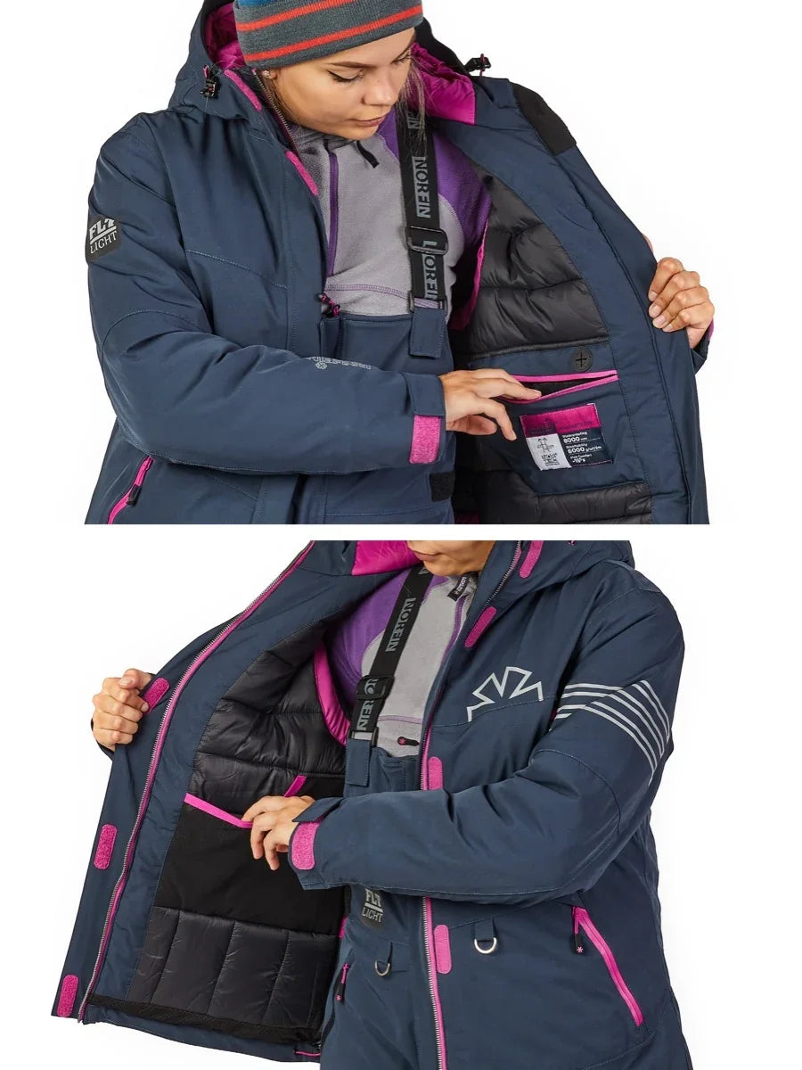 Woman showcasing navy blue insulated jacket with pink accents, ideal for ice fishing and outdoor adventures.