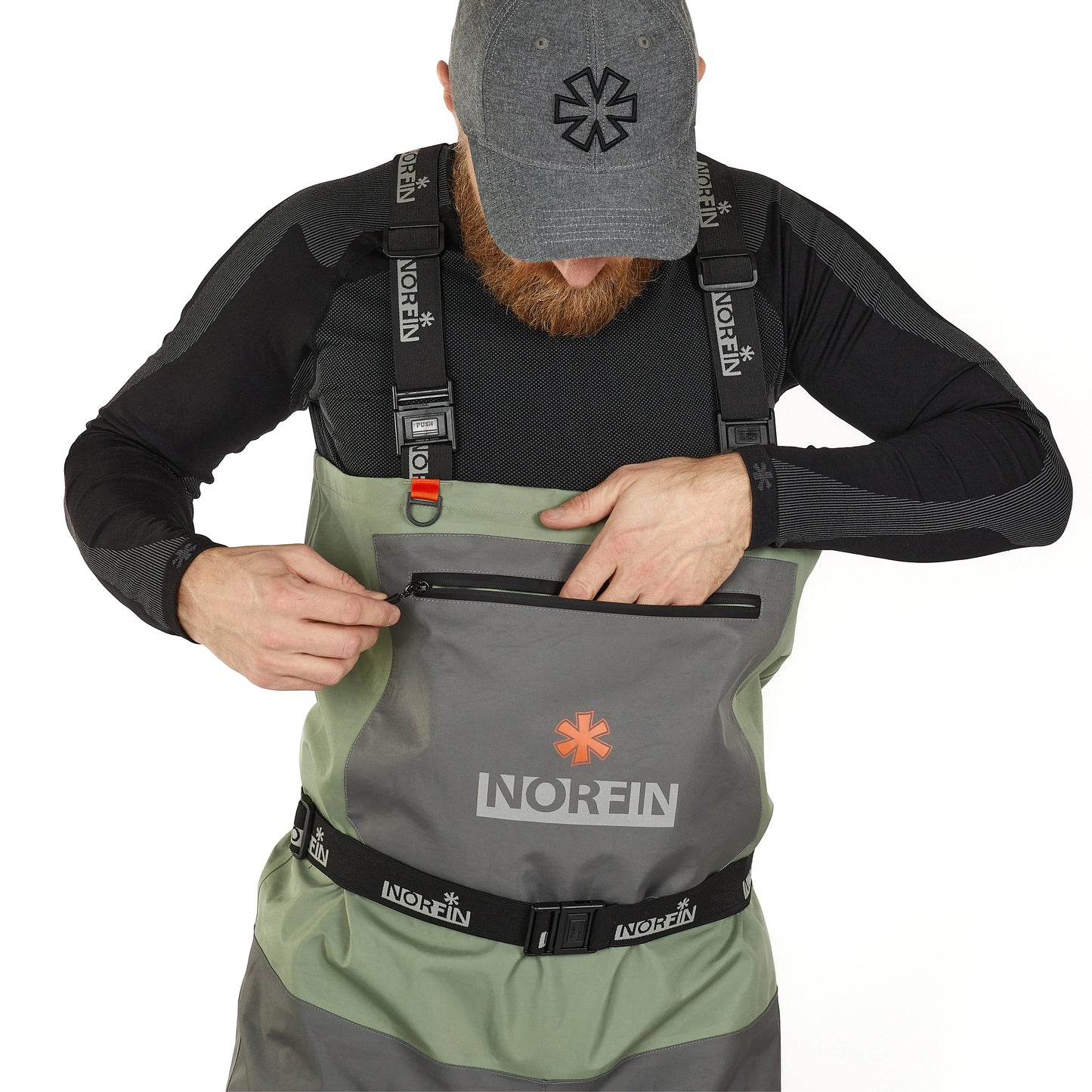 Man wearing Norfin waterproof waders with front pocket and adjustable straps for outdoor fishing adventures