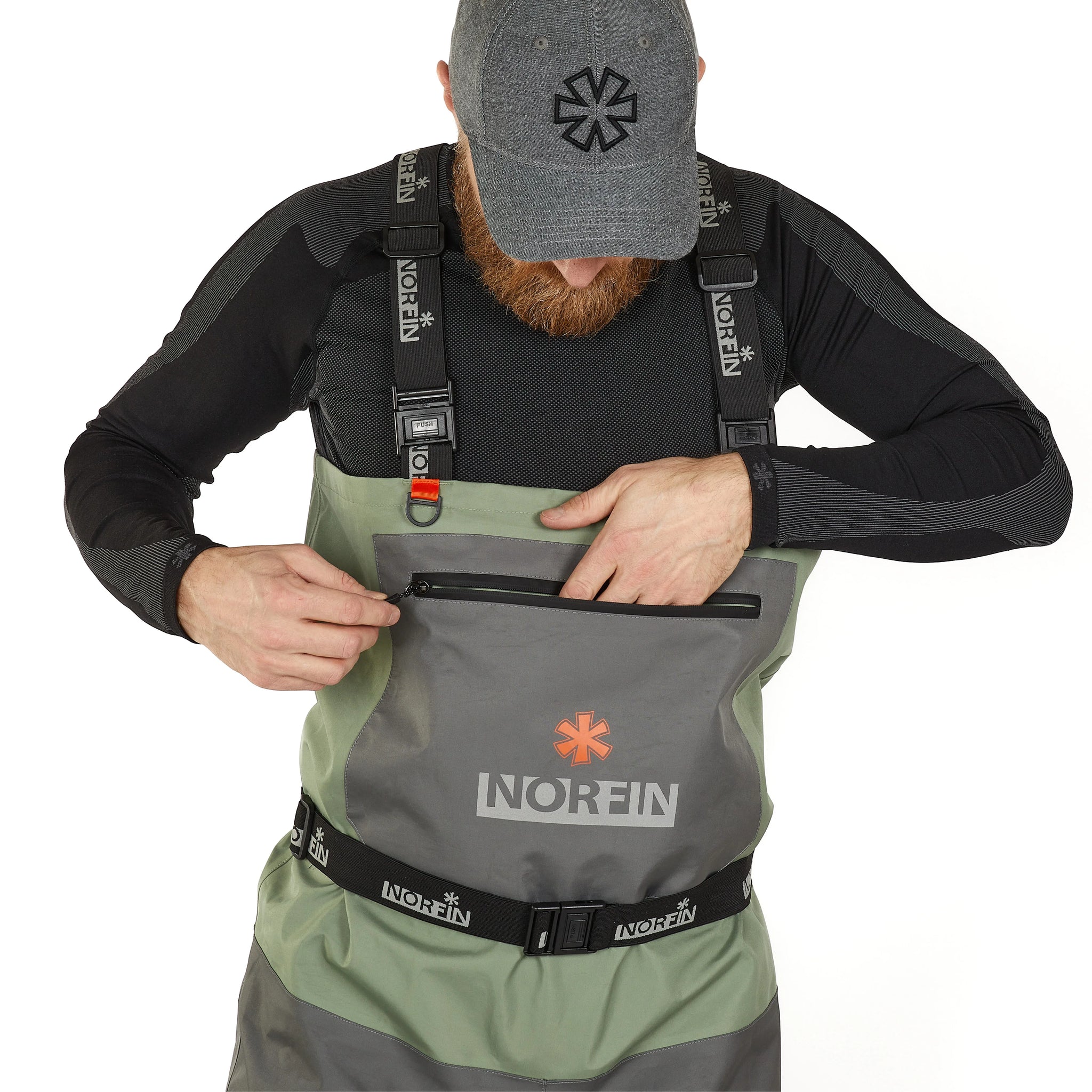 Man wearing Norfin waterproof waders with front pocket and adjustable straps for outdoor fishing adventures