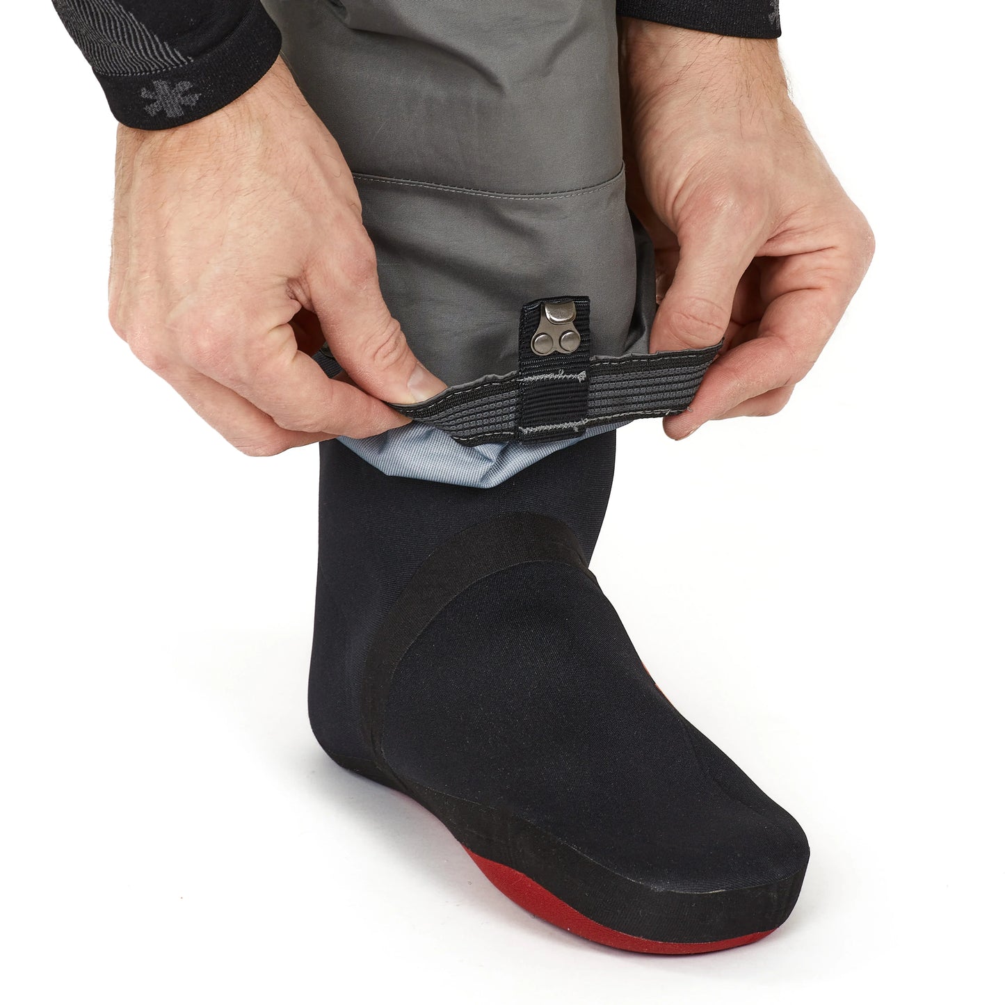 Adjustable waterproof boot with secure strap for outdoor adventures