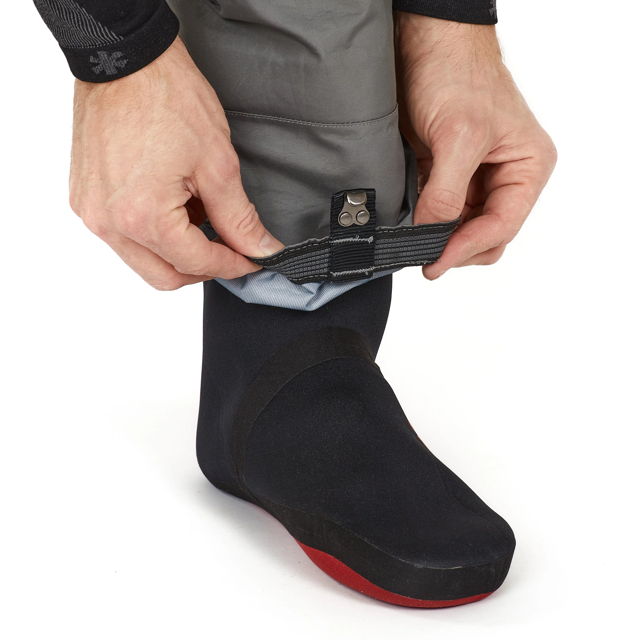Adjustable waterproof boot with secure strap for outdoor adventures